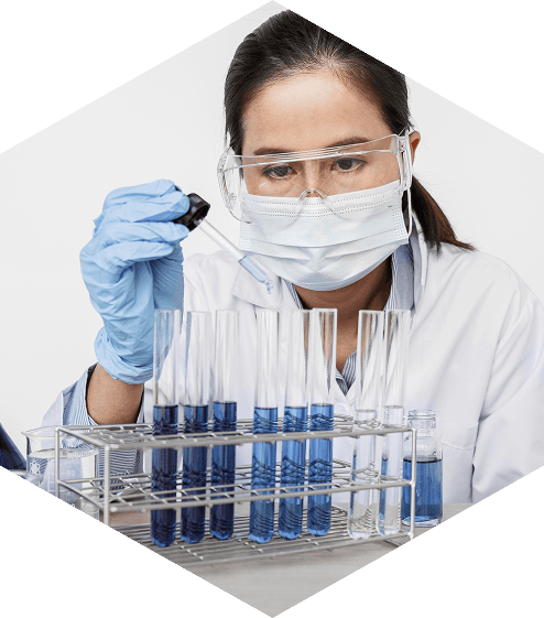 Female scientist working with test tubes in laboratory